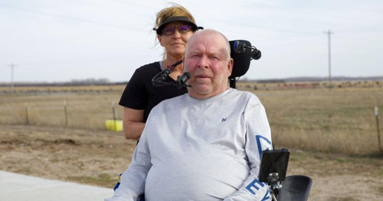 Kevin and Jacque Daniels live outside of Norfolk where they own a feedlot and work with horses. Kevin has a condition called Guillain-Barré that has left him paralyzed from the neck down. He is slowly gaining back movement and said he hopes to one day restore his mobility. He gets around his farm using his electric wheelchair, provided by AgrAbility, and operates it by pressing his cheek and chin against the features of the chair reaching from behind the headrest. The couple learned about AgrAbility through a friend who knew about the program.